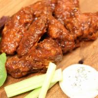 50 piece wings · Served with celery and choice of ranch or blue cheese dipping sauce.  Our all-natural wings ...
