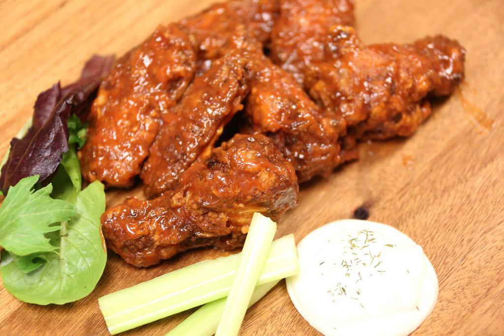 50 piece wings · Served with celery and choice of ranch or blue cheese dipping sauce.  Our all-natural wings are brined and fried to
delicious perfection. Have it your way!