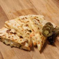 Santa Fe Veggie Quesadilla  · Cheddar cheese, mozzarella cheese, tomato, green peppers, black bean and red onion. Served w...