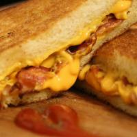Kids Classic Grilled Cheese Sandwich · Served with fries and can
 soda.