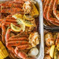 TS Snow Crab Snak Box · Includes 1 snow crab cluster, 6 shrimp, potatoes, 1 corn.
