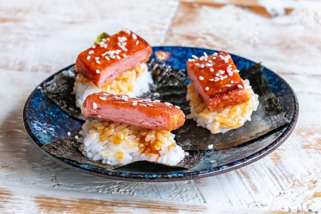 Spam Musubi Bites · Three pieces—fried spam on sushi rice, wrapped with nori seaweed