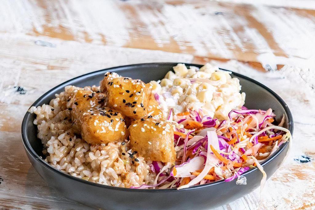Crispy Sesame Tofu · Lightly fried tofu tossed in roasted sesame sauce. Served with Hawaiian mac salad*, cabbage slaw ＆ your choice of base. 
*Mac salad contains seafood
