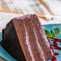 Chocolate Cake · Decadent chocolate cake topped with raspberry sauce.