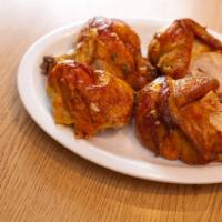 5. Pollo a la Brasa Entero · Whole rotisserie chicken.