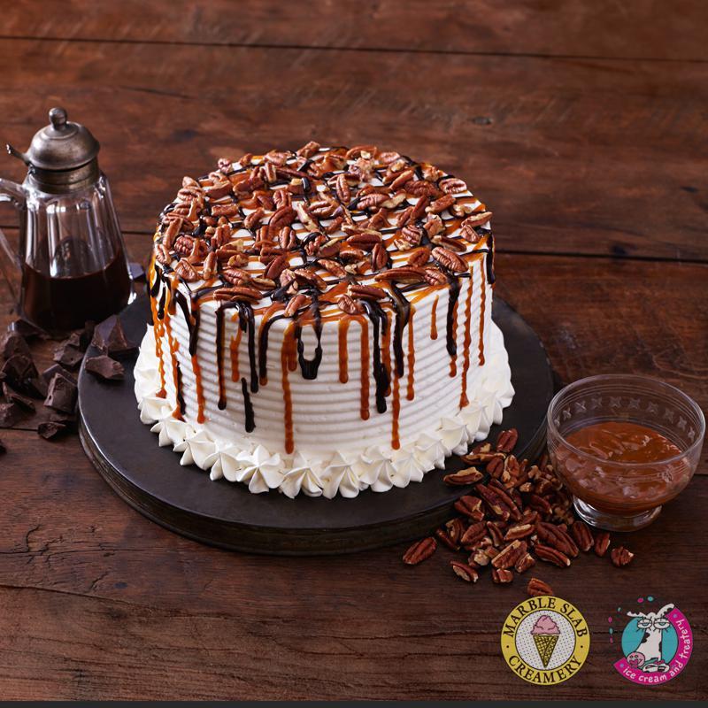 Turtle Ice Cream Cake · We DO NOT DO Any Writing or Custom made cake for all order through Third Party Delivery.  

We’ve turned your favorite candy into a rich, yummy cake with a mix of pecans, fudge and caramel on top of Vanilla Ice Cream and yellow or chocolate cake. Whatever combo you choose, it always adds up to an amazing treat.
