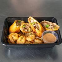 CheeseSteak Eggrolls · Philly cheesesteak inspired eggrolls w/ shrimp fried rice