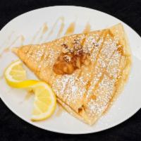 Apple and Pecan Pie Crepe · Apple sauce, roasted pecans, maple syrup, and whipped cream.