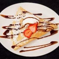 Strawberry Nutella Crepe · Fresh strawberry, Nutella, and chocolate syrup.