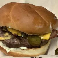 Bacon Jalapeno Cheeseburger · 1/4 lb. burger with bacon, jalapenos, lettuce, tomato, and melts cheese and choice of side.