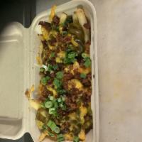 Loaded Fries · Crispy fries, topped with melted cheese, jalapeños, bacon, and scallions