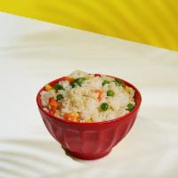 Island Vegetable Rice (GF) · Mixed veggies and rice in a stir fry.