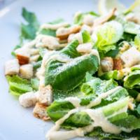 Caesar salad · Romaine, Parmesan, croutons, Caesar dressing on side. 