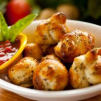 Garlic Knots · (3) Garlic Knots with a side of our famous marinara sauce.