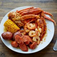 Seafood Box 2(steam) · 2 piece snow crab legs, half lb. medium shrimp and your choice of sausage links or pork. Inc...