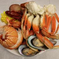 Big Family Seafood Box(steam) · Lobster tail, snow crab legs, dungeness crab, shrimp, crawfish  and your choice of clams or ...