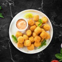Thoughts For Tots · (Vegetarian) Shredded Idaho potatoes formed into tots, battered, and fried until golden brow...
