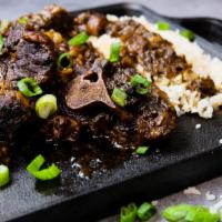 Oxtails ＆ Rice  · Oxtail Seasoned Perfectly w/ Rice and Peas or White Rice