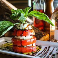 Insalata Caprese Lunch · Slices of tomato, mozzarella cheese, basil leaves, olive oil, and a touch of balsamic vinega...