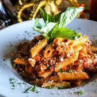 Penne Bolognese Lunch · Ground beef is slow cooked for 4 to 6 hours in a tomato sauce with carrots, onion, celery, r...