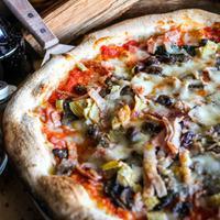 Capriccio di Traiano Pizza Lunch · Crushed san Marzano tomato, buffalo mozzarella, prosciutto cotto, mushrooms, artichokes, bla...