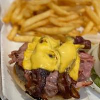HRI Burger · Juicy topped with sauteed onion bacon, Dearborn ham and American cheese.