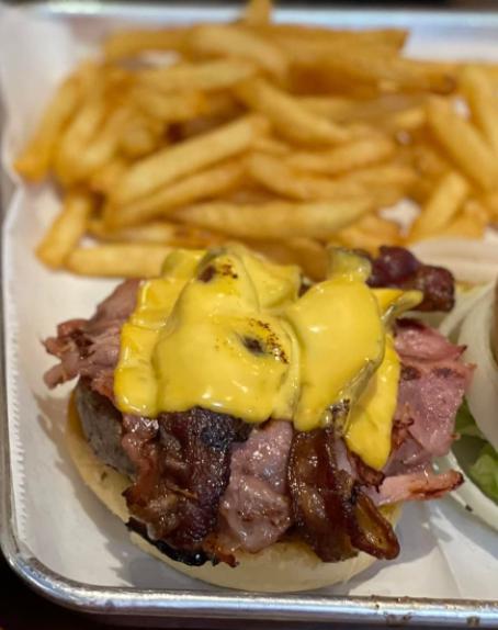 HRI Burger · Juicy topped with sauteed onion bacon, Dearborn ham and American cheese.