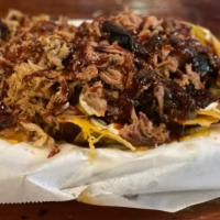BBQ Nachos · Brisket or pulled pork. Homemade chips with jalapenos, cheese, sour cream, tomatoes and hous...