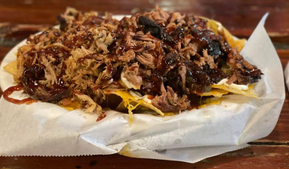 BBQ Nachos · Brisket or pulled pork. Homemade chips with jalapenos, cheese, sour cream, tomatoes and house BBQ.