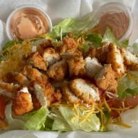 Chicken Salad · Grilled or crispy. Juicy chicken breast on a bed of lettuce, tomato, shredded cheese, crouto...