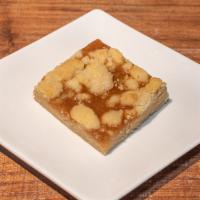 Salted Caramel Bar · This dense bar is made with a shortbread base our fresh homemade caramel sauce and topped wi...