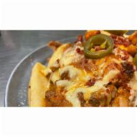 Chili Cheese Fries · Fries topped with homemade chili , cheese and jalapeño. 