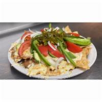 Small Botana · Corn chips with chorizo beans, cheese, avocados, tomatoes, green peppers, onions, olives and...