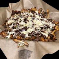 Steak Fries · Fries with steak, mushrooms, onions, bell peppers and pizza cheese melted on top. Salt and p...