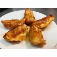 Chicken Potstickers (5) · Chicken Potstickers deep fried w/ Teriyaki Sauce