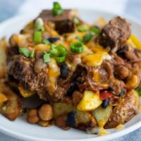 Chili Cheese Roastie · Roasted potato spears slathered in colby jack cheese and our hearty beef and three bean chil...