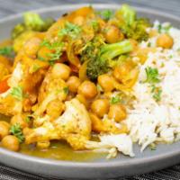 Kerala Vegetable Curry · Flavors of the south Asian trade winds come alive with this coconut curry loaded with season...