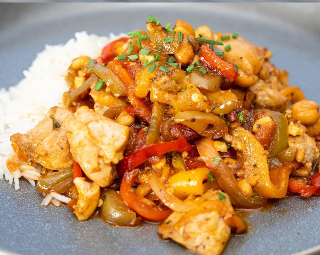 Kung Pao Chicken · Classic robust favorite of red chili and chicken stir fry with bell peppers and cashews served on a bed of basmati rice. (grain options available). Gluten-free, milk-free.