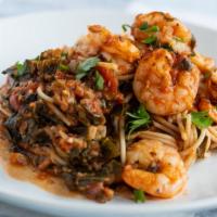 Spaghetti Alla Gamberetti · Spaghetti and seasoned shrimp tossed in our savory, robust house marinara sauce and braised ...