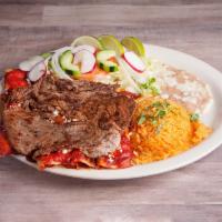 Enchiladas Rojas con Carne · Red sauce with steak. Stuffed with queso fresco. Sauce and steak on top. With rice, beans, a...