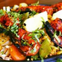 Tandoori Shrimp · Shrimp marinated in a light spicy sauce, homemade yogurt and skewered then cooked in a clay ...