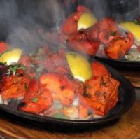 Chicken Tikka · Cubes of chicken marinated in light spices and yogurt and roasted in a clay oven.