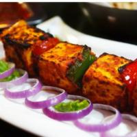 Paneer Tikka · Indian cheese marinated with yogurt, spices and cooked in a clay oven.