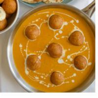 Malai Kofta · Potato and cottage cheese dumpling cooked in mild gravy with a dash of cream.