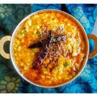 Tadka Dal · Split lentil cooked with ginger, turmeric and tomatoes then tempered with mustard seed, onio...