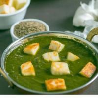 Palak Paneer · Cubes of freshly made cottage cheese simmered with spinach and spices.
