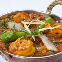 Shrimp Kadai · Boneless meat sauteed with bell peppers, onions and a blend of spices.