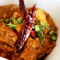 Vindaloo · Choice of 1 of the following: Boneless chicken, lamb, fish or shrimp cooked with potatoes, h...