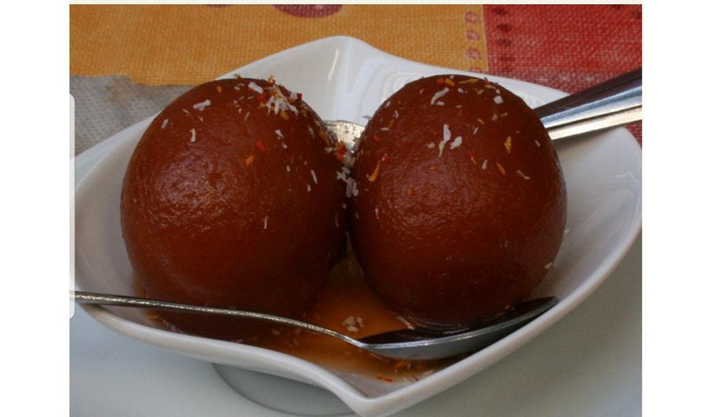 Gulab Jamun · Small rolls made with milk and wheat flour soaked in flavored syrup.