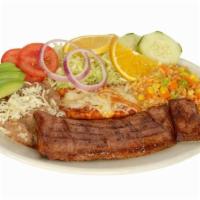 Tampiqueña  · Tender skirt steak. Served with 1 enchilada, rice, beans and salad.